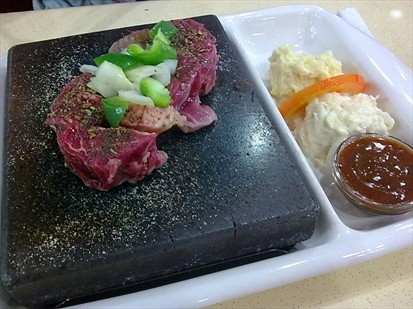meat cooked on the hot stone