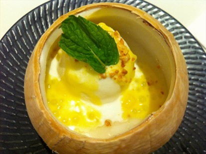 Chilled Coconut Lotus Seed Pudding served in Young Coconut
