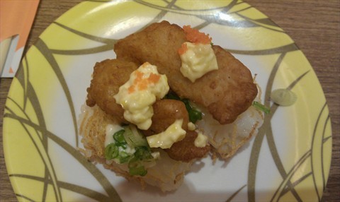 fried fish sushi coated with potato strips