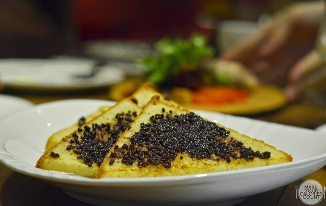 Baked brioche with a smear of the grape juice blended mustard sauce