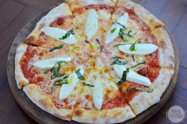 Pizza Margarita with Tomato and Buffalo Mozzarella | $19++