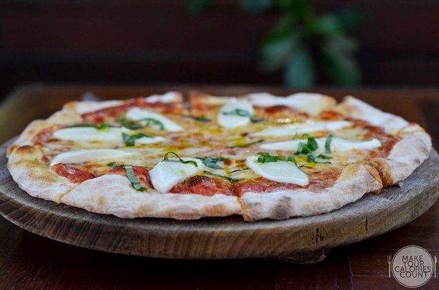 Pizza Margarita with Tomato and Buffalo Mozzarella | $19++