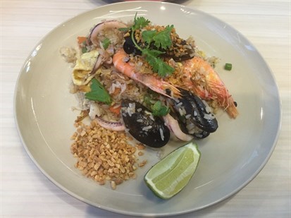 Feast  of  seafood  tossed  in  Thai  garlic  and  flavourful  Hom  Mali  rice