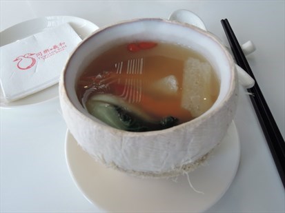 Double boiled soup served in coconut!