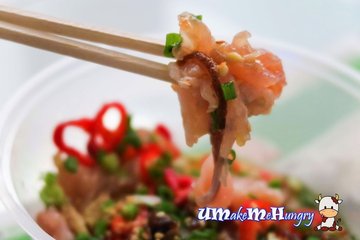 A mouthful of Yu Sheng / Raw Fish