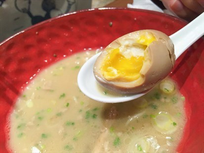 The ramen egg reminded me of a Kinder Surprise — while most Japanese restaurants serve HALVED eggs,