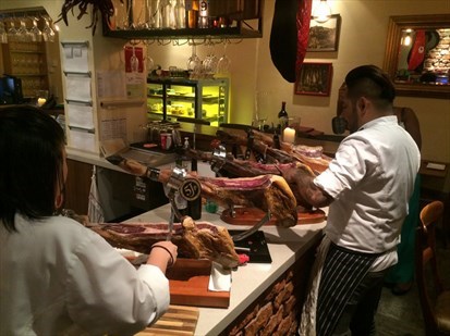 A hands-on carving session with the specialist - Various types of freshly carved Spanish hams.