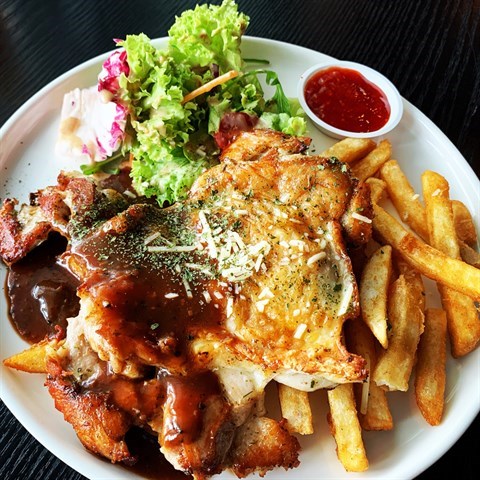 Marinated grilled chicken thigh served with fries & salad.