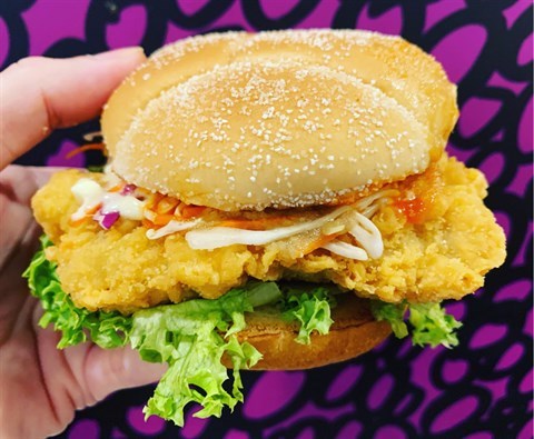 Flavourful ginger sauce & garlic chilli sauce on a crispy chicken patty with a drizzle of dark sweet sauce, all between hearty semolina buns.