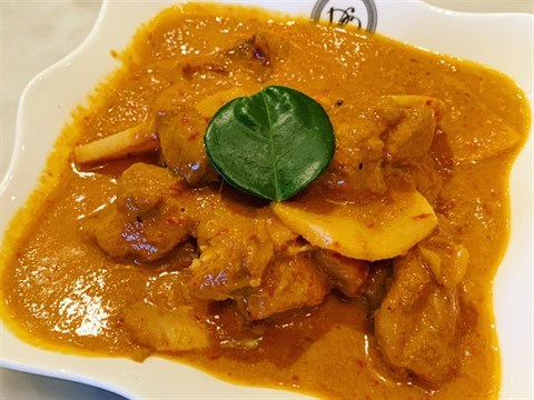 Chicken thigh stewed in a melange of spices in coconut gravy with bamboo shoots.