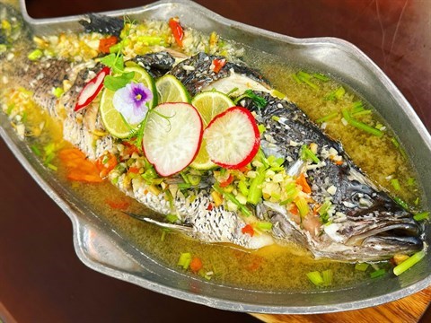 Steamed seabass submerged in a robust blend of zesty chilli-lime soup, accompanied with selected farm-fresh edible flowers & herbs. 